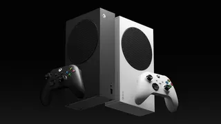 Two crisply styled Xbox Series S consoles, one white, one black, against a black background.