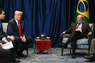 Brazil's President Luiz Inacio Lula da Silva (R) talks to US President Donald Trump during a bilateral meeting on the sidelines of the 47th Association of Southeast Asian Nations (ASEAN) Summit in Kuala Lumpur on October 26, 2025, as US Secretary of State Marco Rubio (L) looks on. (Photo by ANDREW CABALLERO-REYNOLDS / AFP)