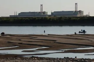 Sandbanks in the foreground left by the retreating Danube, with the power plant behind