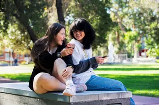 Annie Wang, 15, and Novva Tolson, 15, pose as they scroll through their social media feeds, in Sydney, Australia July 14, 2026. REUTERS/Jeremy Piper