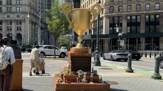 Giant golden 'participation trophy' statue in Foley Square, New York