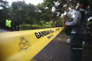 A man reported missing by his wife last week was found dead, bound and wrapped in netting, in Sungai Tanjung Sembrong, Parit Raja, yesterday. - NSTP/MOHD ADAM ARININ