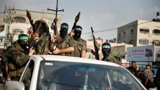 FILE PHOTO: Hamas militants celebrate what they say is a victory over Israel after an eight-day conflict during a rally in the northern Gaza Strip November 22, 2012
