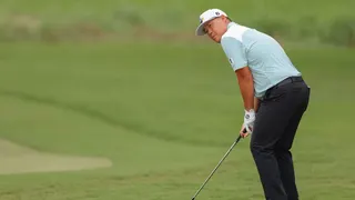 Sungjae Im chips onto the sixth green during the final round of the 2025 Wyndham Championship in Greensboro, North Carolina.