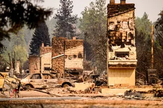 Chimneys are seen where houses once stood after a fire