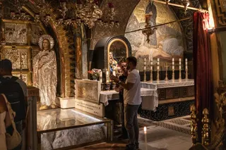 Christian pilgrims visit the site of Golgotha (Calvary), the location where according to tradition Jesus Christ was crucified, at the Church of the Holy Sepulchre in the old city of Jerusalem on August 4, 2026.