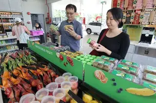 Cold Storage’s first On The Go store opened at the Esso petrol station in East Coast Road on Aug 3.
