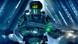 Master Chief wearing green tactical armor and a gold visor, holding a futuristic assault rifle inside a glowing blue geometric corridor structure.