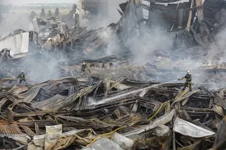 Rescuers work at the site of a Russian missile strike on a goods storage in Kyiv on Wednesday.