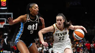 Caitlin Clark driving to the basket against Angel Reese at State Farm Arena in Atlanta