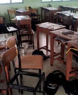 Students' belongings and furniture scattered in a classroom, following a shooting incident at Debsirin Nonthaburi School