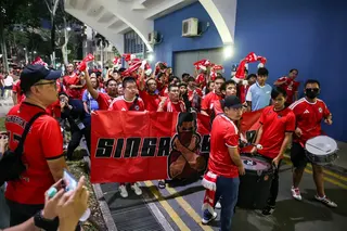 Lions fans cheering outside the Jalan Besar Stadium ahead of the ASEAN Championship Group A match between Singapore and Indonesia on Aug 7.
