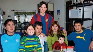 Lionel Messi poses with his brother Rodrigo, sister Maria Sol, father Jorge, mother Celia, nephew Tomas and brother Matias during a private photo session in October 2003