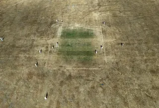 An aerial photo taken with a drone shows a drought-damaged cricket pitch in Cockfosters, North London, Britain at the weekend. Photo: EPA