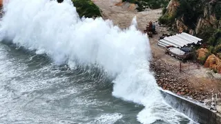 Huge waves crash on the coast of Huangqi in Lianjiang county, as Typhoon Dolphin approaches, in Fujian