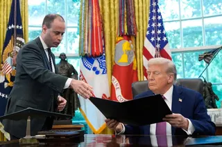 FILE - White House staff secretary Will Scharf, left, hands President Donald Trump an executive order to sign in the Oval Office of the White House, Sept. 5, 2025, in Washington. (AP Photo/Alex Brandon, File)