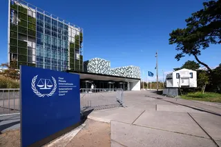 FILE PHOTO: People stand outside the International Criminal Court in the Hague, Netherlands, September 22, 2025. REUTERS/Piroschka van de Wouw/File Photo