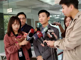 北市府前發言人李政軒(中)。(本報系資料照)