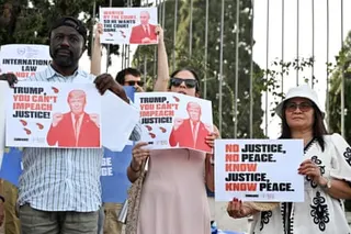 people hold signs that read 'Trump you can't impeach justice'