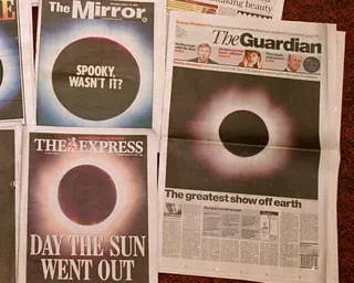Front pages of British national daily newspapers showing photographs of the total eclipse that occured over parts of western Europe, the Middle East and the Indian sub continent.