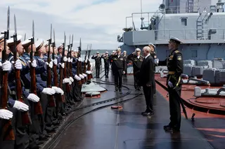 Russian President Vladimir Putin welcomed on board a missile cruiser in Russia’s far Sakhalin region on Wednesday. Photo: Sputnik/Reuters