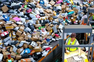 Staff members sort express parcels at the China Post Zaozhuang branch in Shandong province. Photo: Xinhua