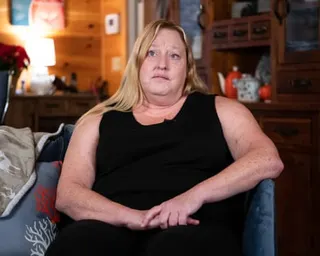 a woman sits on a chair