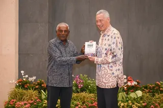 Professor S. Jayakumar presenting SM Lee Hsien Loong with the book – Creating Three Unique Singapore Laws: An Inside Story – at the Ministry of Foreign Affairs on Aug 12.