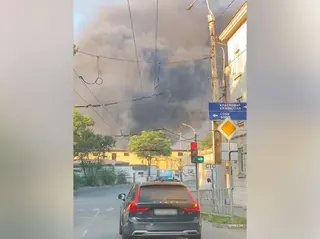A plume of smoke rising over Novorossiysk