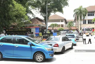 This file picture dated Oct 15, 2025 shows an ambulance at the school following the incident. - NSTP/AMIRUDIN SAHIB.