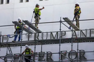 Construction crews build scaffolding outside The Kennedy Centre in June, after a court ordered that Trump’s name be removed from the building. Photo: AFP