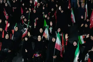 Iranian pro-government demonstrators attend a gathering at a square in Tehran on Tuesday. Photo: AP