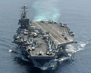 An aircraft carrier at sea.