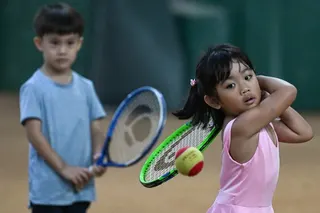 A child takes part in a training session at Alabang Tennis Academy in Muntinlupa, Metro Manila. Photo: AFP
