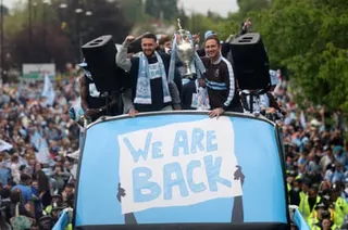 Coventry captain Matt Grimes and manager Frank Lampard hold the Championship trophy.