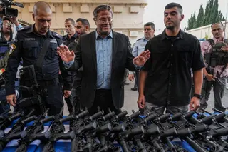 Israel's National Security Minister Itamar Ben-Gvir attends an event to deliver weapons to local volunteer security group members in Ashkelon, Israel, Friday, Oct. 27, 2023. (AP Photo/Tsafrir Abayov)