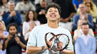 Ben Shelton smiles as he holds the Canadian Open trophy