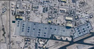 A satellite image shows aircraft at the Al Udeid Air Base, near Doha, Qatar, in February. Image: Planet Labs PBC via Reuters