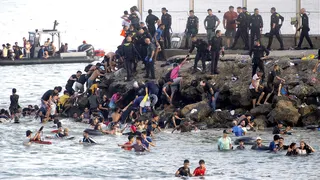migrants swimming into Ceuta