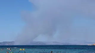 Smoke rises in Salamina during wildfire as seen from Agistri island
