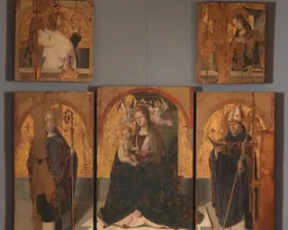 Five weathered panels from a polyptych depicting saints, angels, and Madonna with child