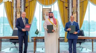 Turkish President Tayyip Erdogan, Saudi Crown Prince Mohammed bin Salman, and Pakistan's Prime Minister Shehbaz Sharif pose after signing a joint defence agreement in Mecca, Saudi Arabia, August 7, 2026. Saudi Press Agency/Handout via REUTERS ATTENTION EDITORS - THIS PICTURE WAS PROVIDED BY A THIRD PARTY. WATERMARK FROM SOURCE TPX IMAGES OF THE DAY