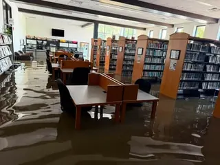 Floodwater inside the Yorktown Public Library in Yorktown, Indiana, on 13 August 2026.
