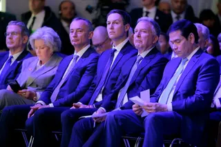 DAVOS, SWITZERLAND - JANUARY 22: (L-R) United States Secretary of the Treasury Scott Bessent, White House Chief of Staff Susie Wiles, former UN Middle East envoy Nickolay Mladenov, Donald Trump's son-in-law Jared Kushner, United States Special Envoy to the Middle East Steve Witkoff and United States Secretary of State Marco Rubio watch as U.S. President Donald Trump presents the “Board of Peace” onstage at the World Economic Forum (WEF) on January 22, 2026 in Davos, Switzerland. The US-backed “B
