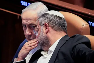 Israel’s Minister of National Security Itamar Ben-Gvir speaks to Prime Minister Benjamin Netanyahu during a parliamentary session on July 16. Photo: Reuters
