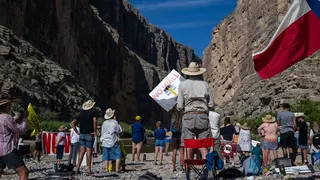 Demonstrators against the construction of a section of the US-Mexico border wall during a protest at Santa Elena Canyon in Big Bend National Park, Texas, US, on Wednesday, Aug. 12, 2026.