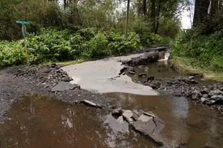 A road damaged by Hurrican Lala is seen in Mountain View, Hawaii, on August 16, 2026. — AFP pic
