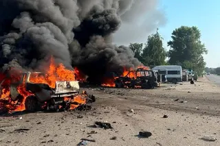 Vehicles burn after Russian drone strikes in the town of Pechenihy on Tuesday. Photo: Press service of the State Emergency Service of Ukraine in Kharkiv region/Handout via Reuters
