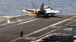 U.S. Navy fighter jet takes off from aircraft carrier
