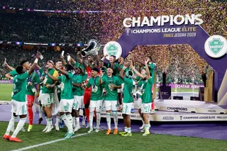 Al Ahli players celebrate with the trophy after winning the Asian Champions League